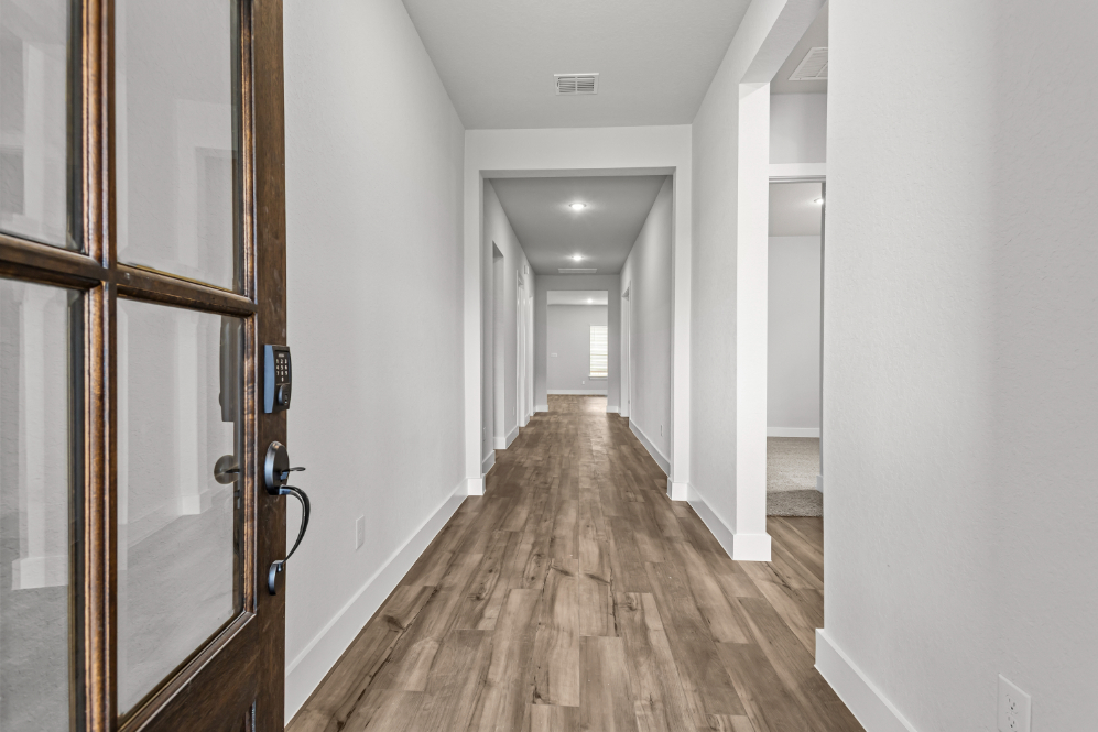 A hallway with glass doors.