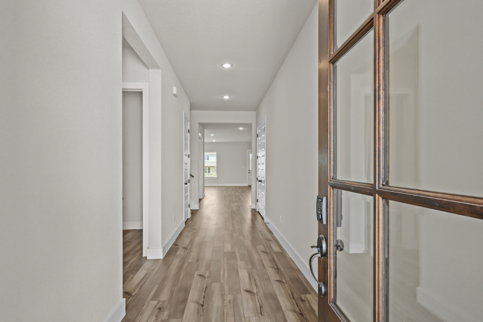 A hallway with white walls.