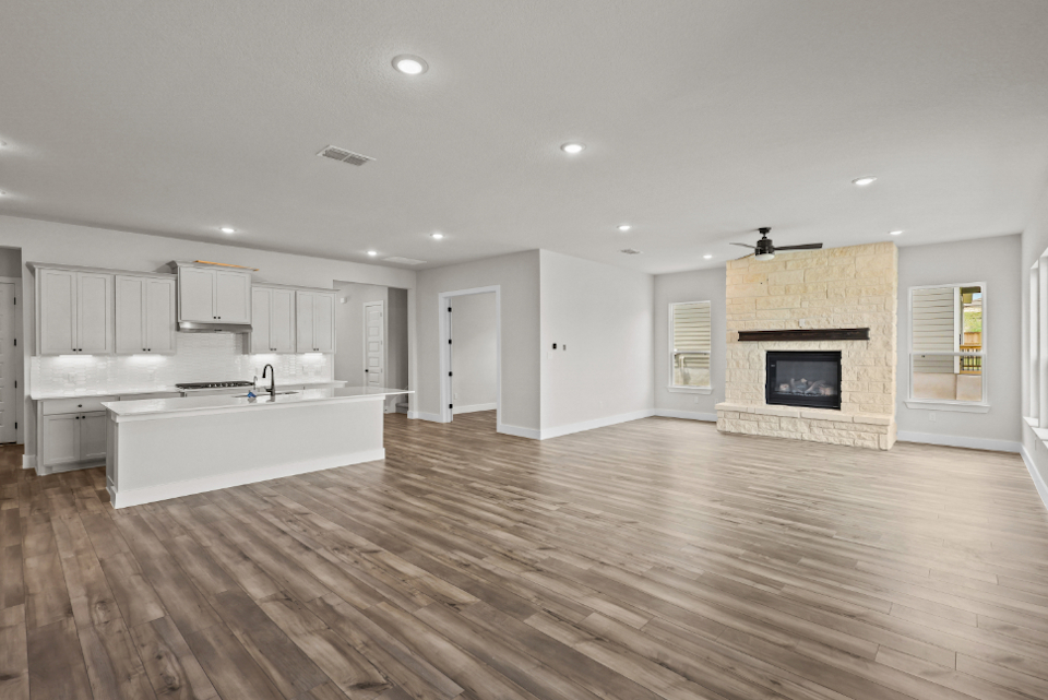 A large kitchen with a fireplace.