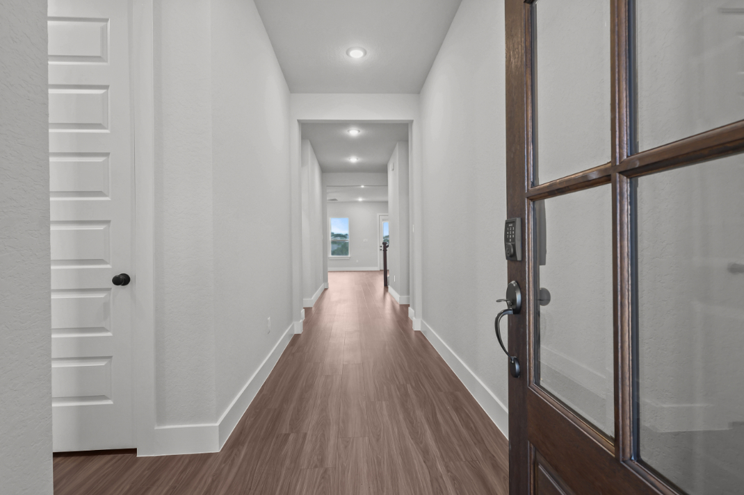 A hallway with white doors.