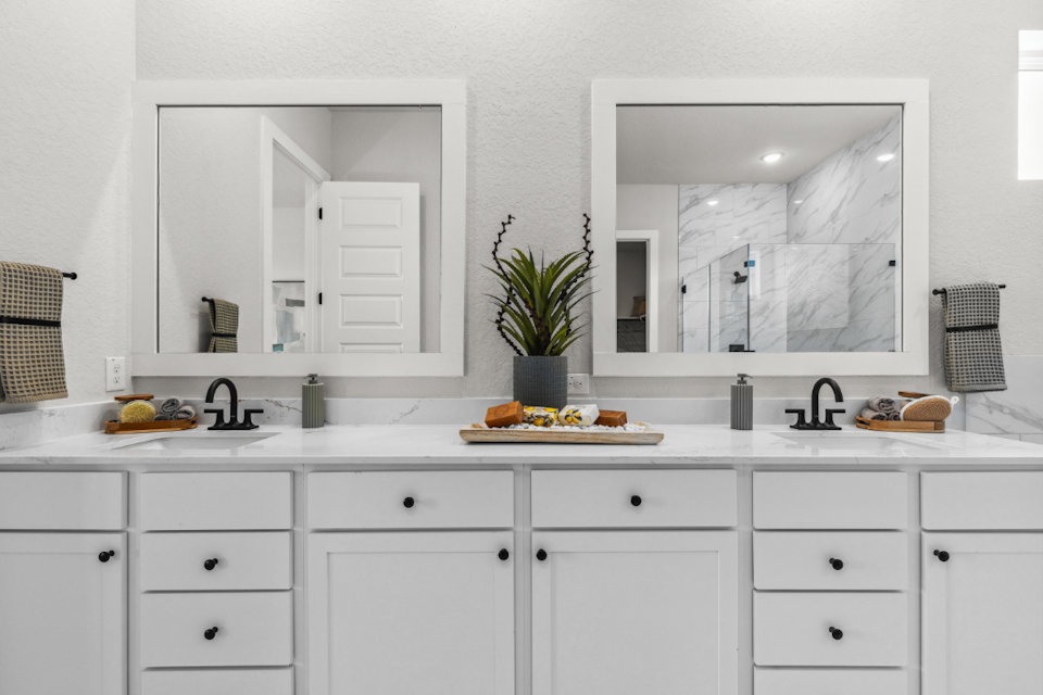 A white kitchen with white cabinets.
