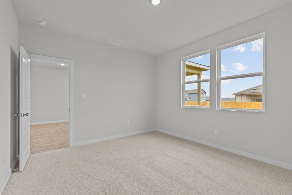 A room with a door and windows.