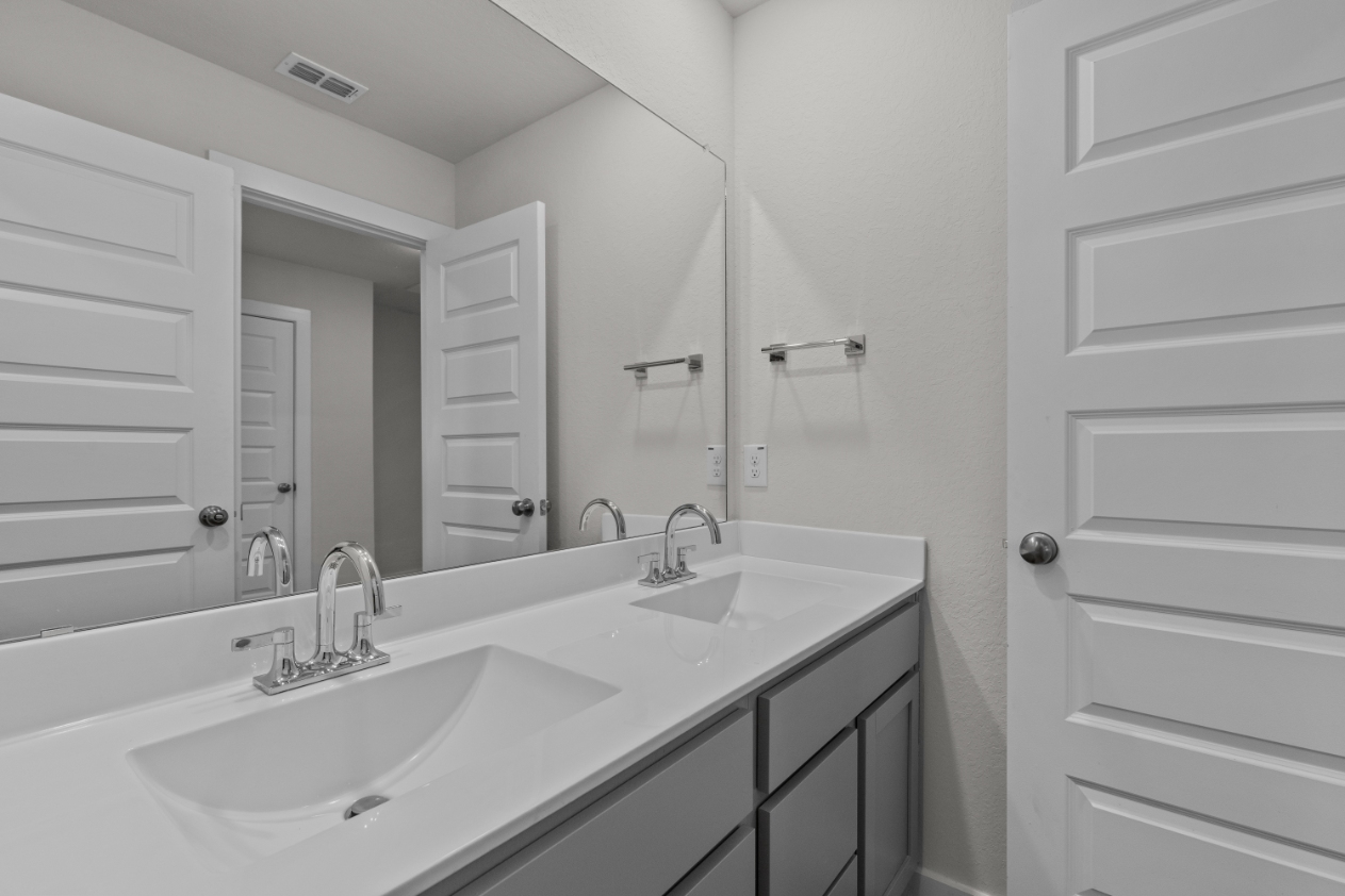 A bathroom with two sinks.