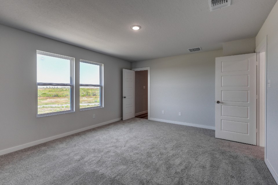 A room with white walls and windows.