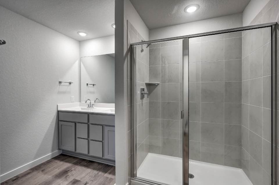 A bathroom with a glass shower.