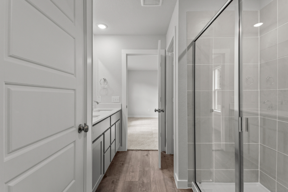 A bathroom with a glass shower.