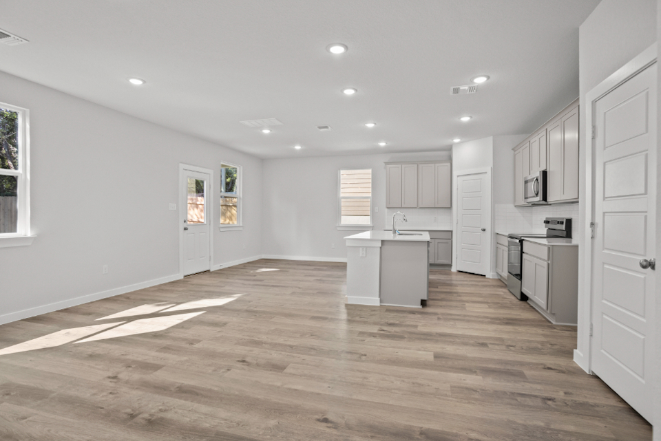 A large kitchen with white cabinets.