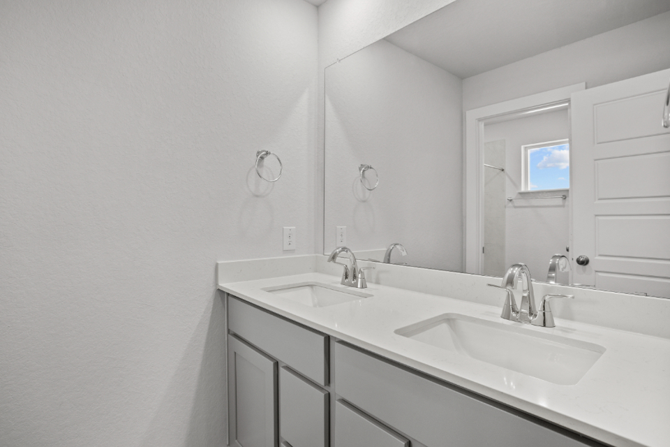 A bathroom with two sinks.