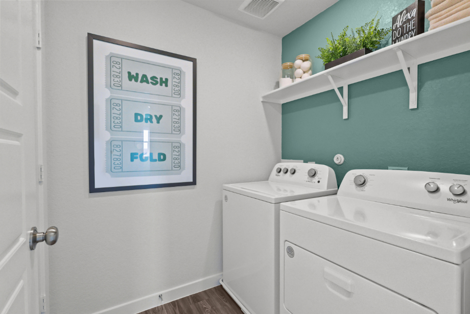 A white wall with a sign on it.