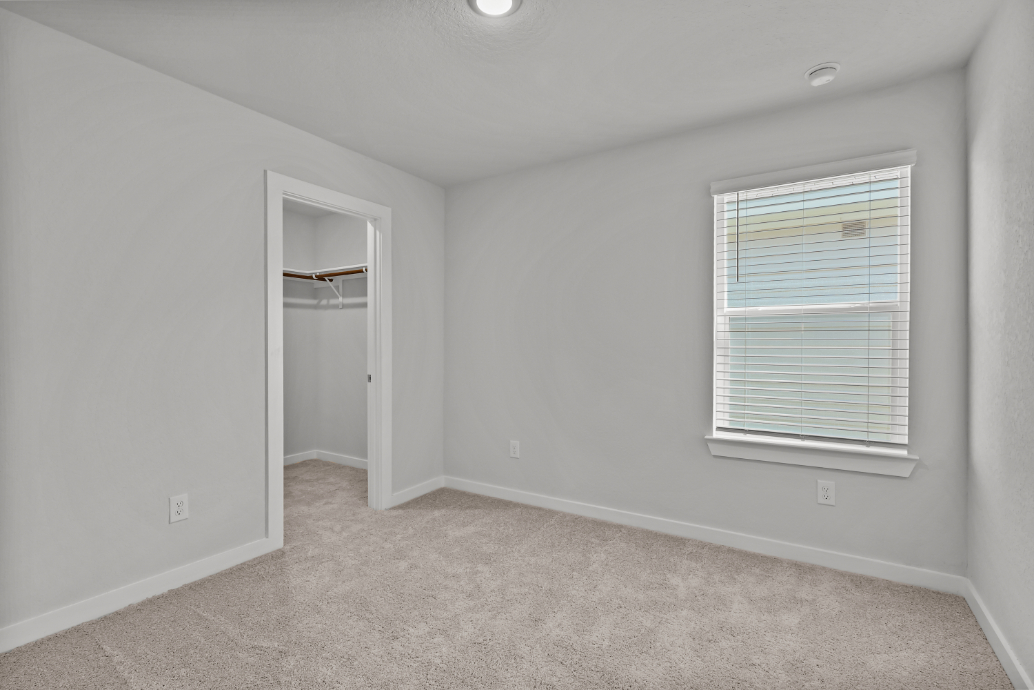 A room with a door and a window.