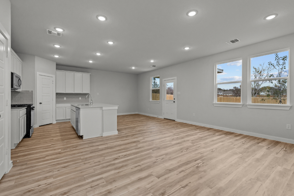 A large kitchen with white cabinets.