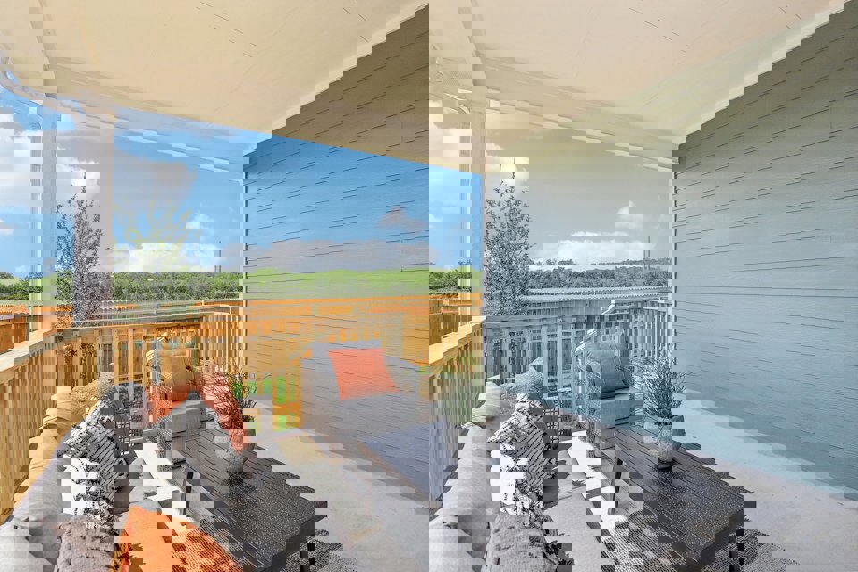 A patio with a table and chairs.