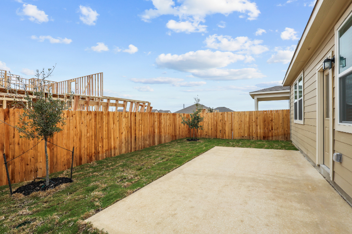 A driveway between two buildings.