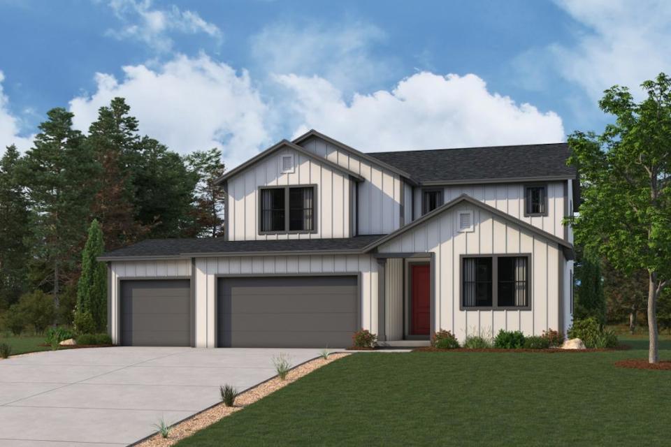 A house with a lawn and trees.