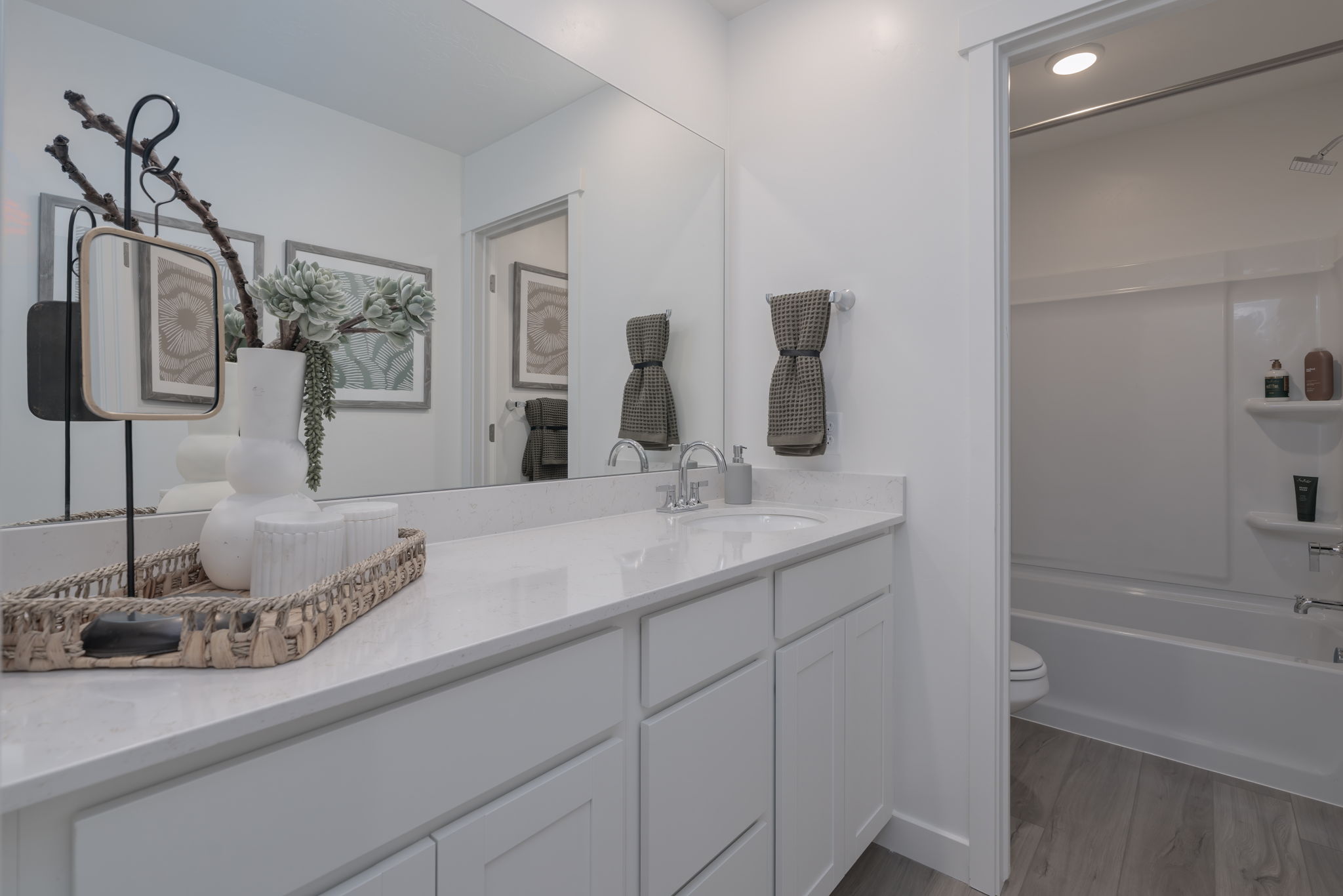 A bathroom with a large mirror.