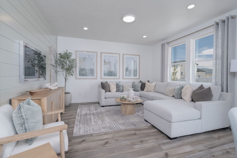 A living room with a couch and a table.