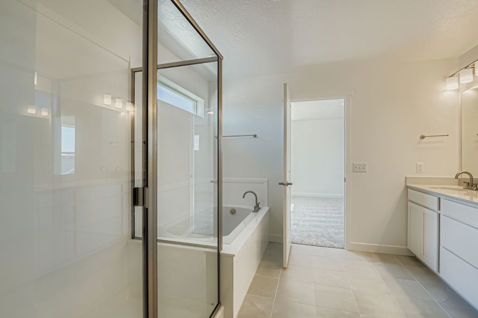 A bathroom with a glass shower.