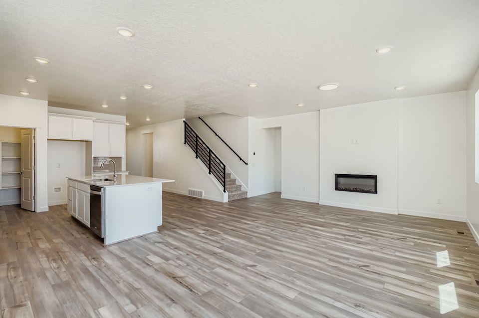 A large kitchen with white cabinets.