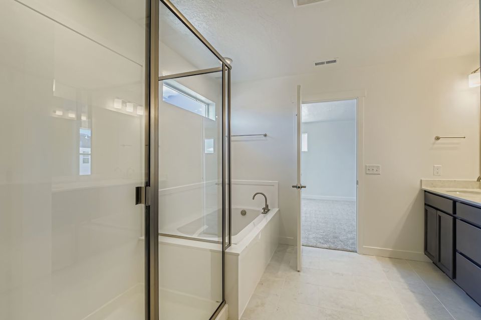 A bathroom with a glass shower.