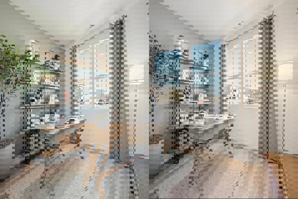 A room with a table and shelves.