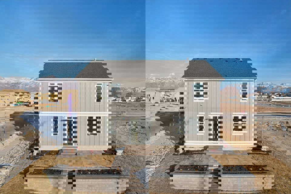 A white building with a black roof.