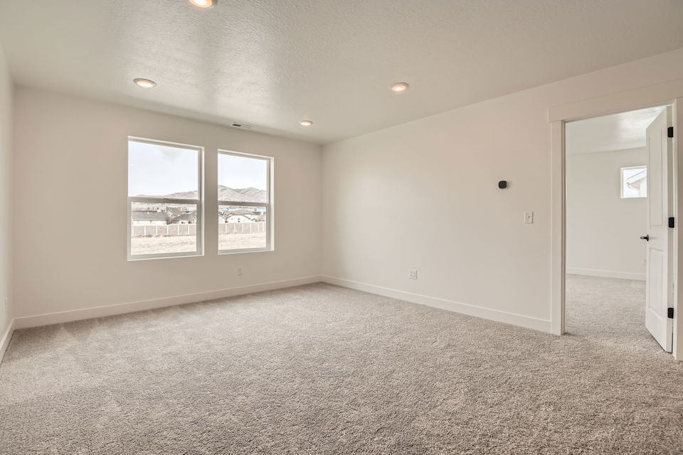 A room with a window and a door.