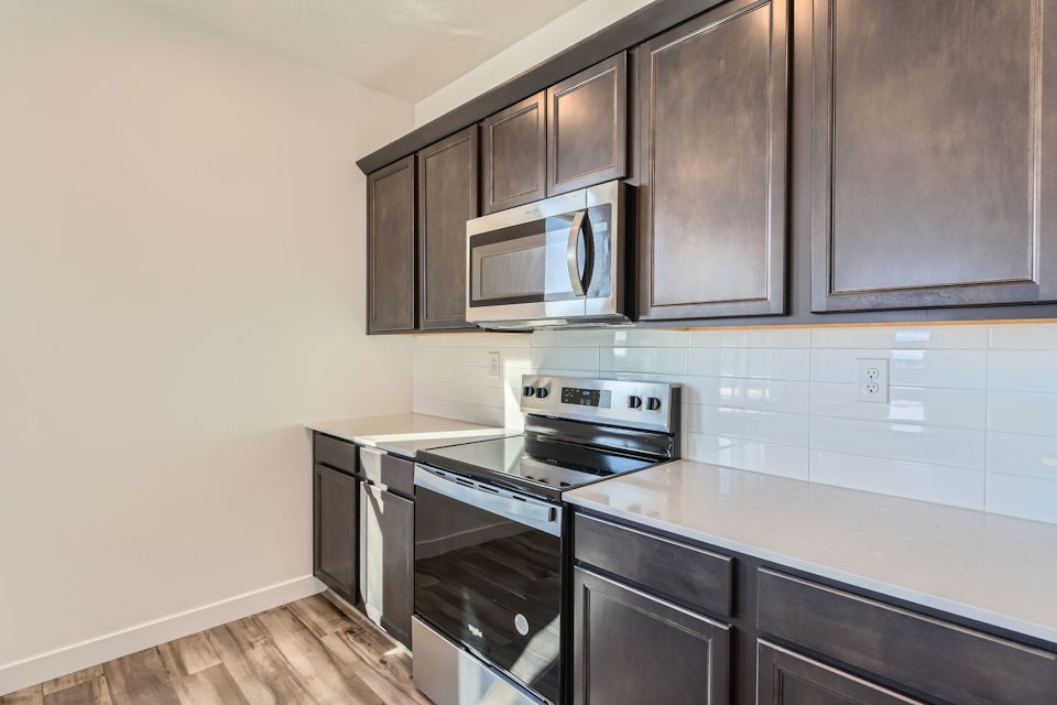 A kitchen with black appliances.