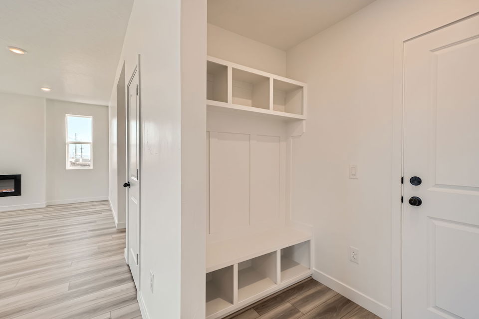A room with white cabinets.