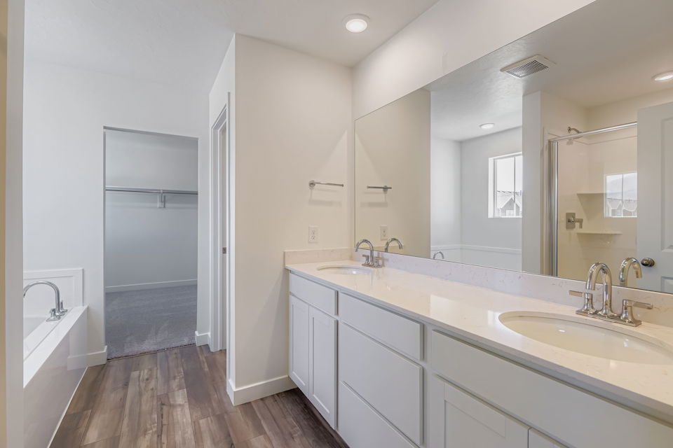 A bathroom with a large mirror.