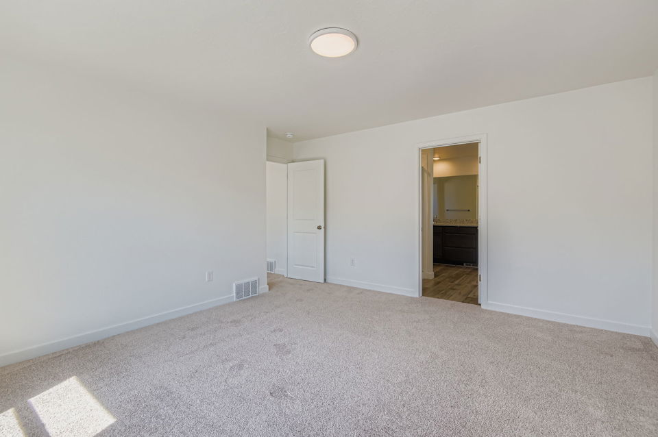 A hallway with white doors.