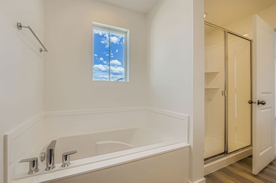 A bathroom with a tub and sink.