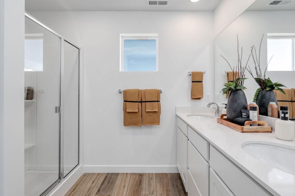 A bathroom with a sink and a shower.