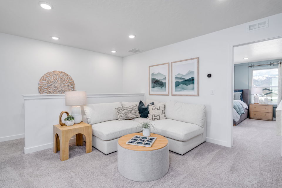 A living room with a white couch.