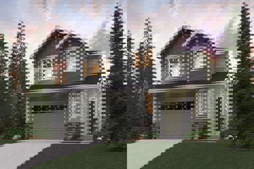 A house with a garage and trees around it.