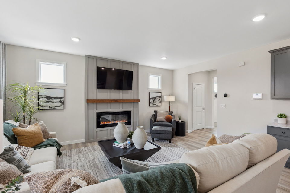 A living room with a fireplace.