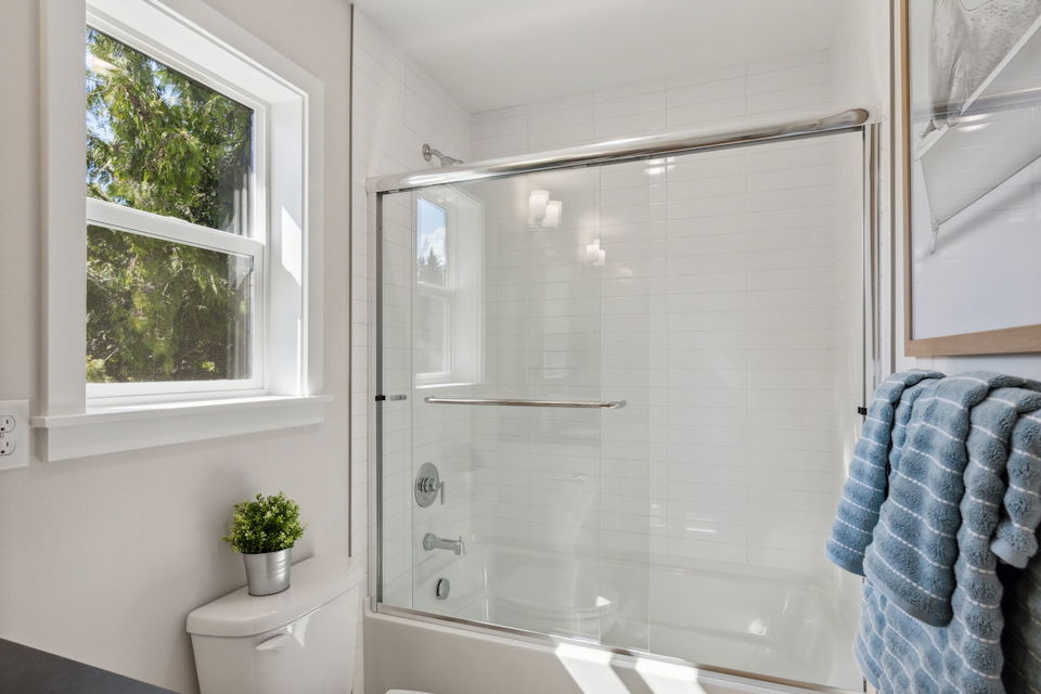 A bathroom with a glass shower.