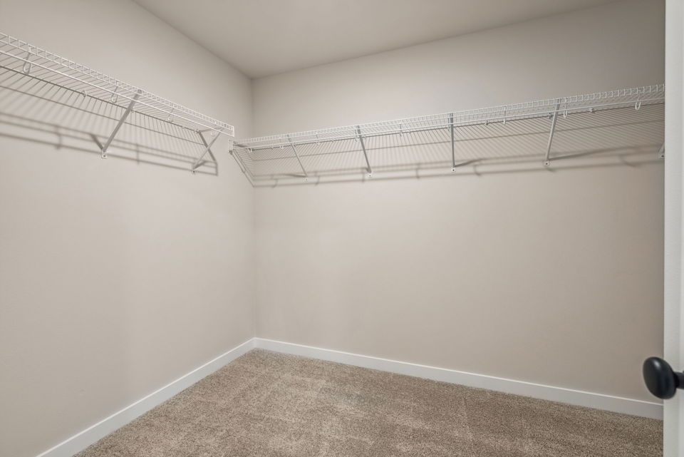 A white wall with a metal frame.