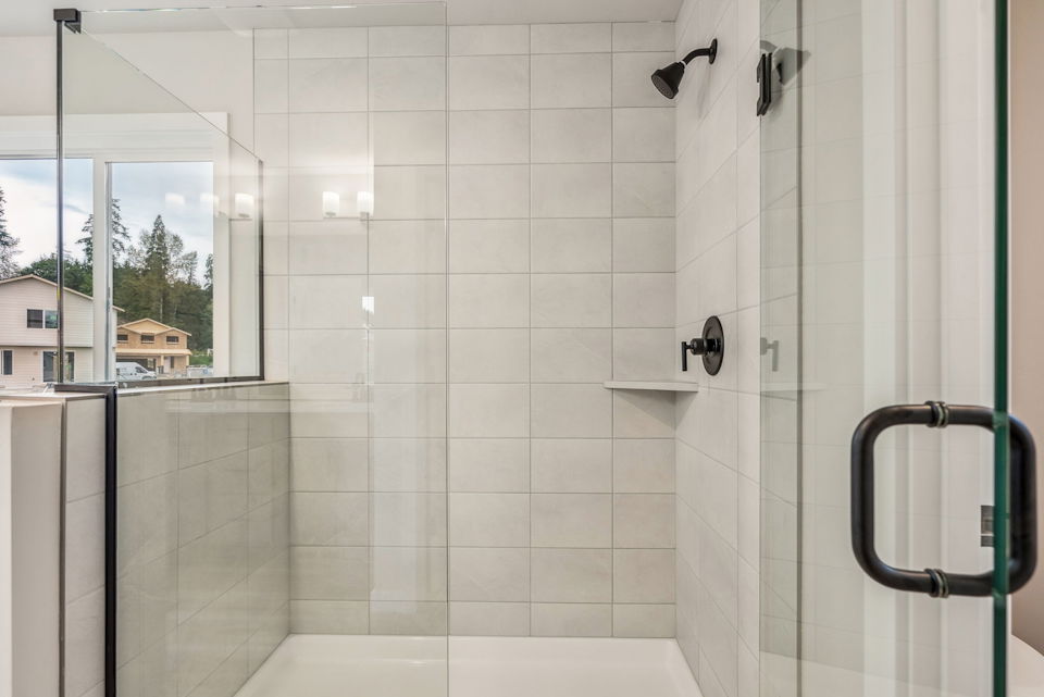 A bathroom with a glass shower.