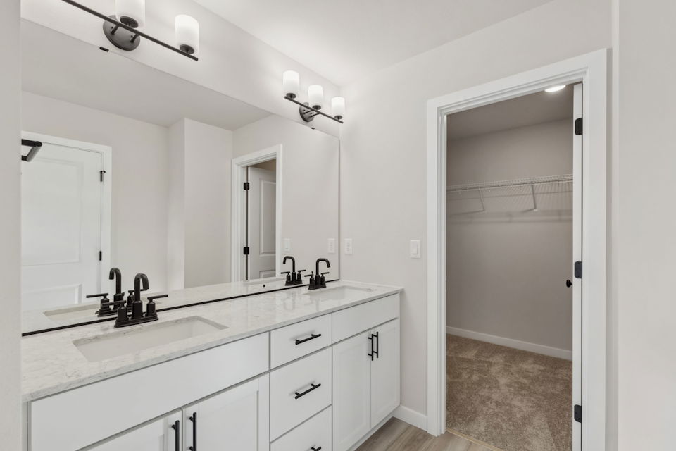 A bathroom with a shower and sink.