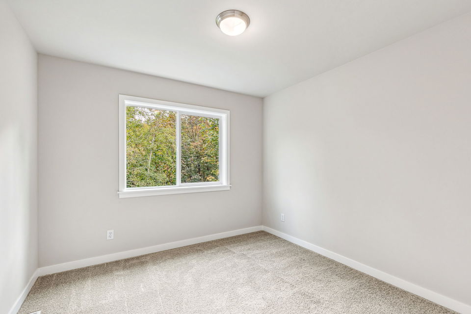 A room with a window and a light.