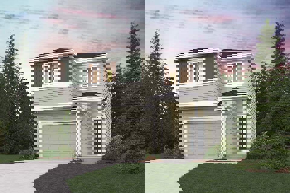 A white house with a garage.