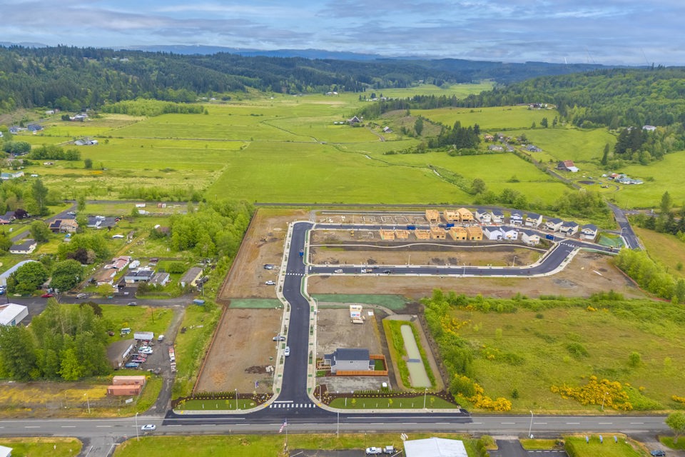 An aerial view of a road and fields.