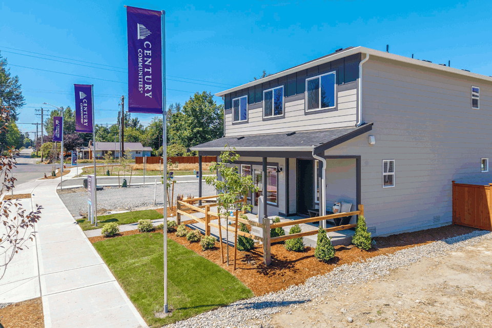 A house with a sign in front.