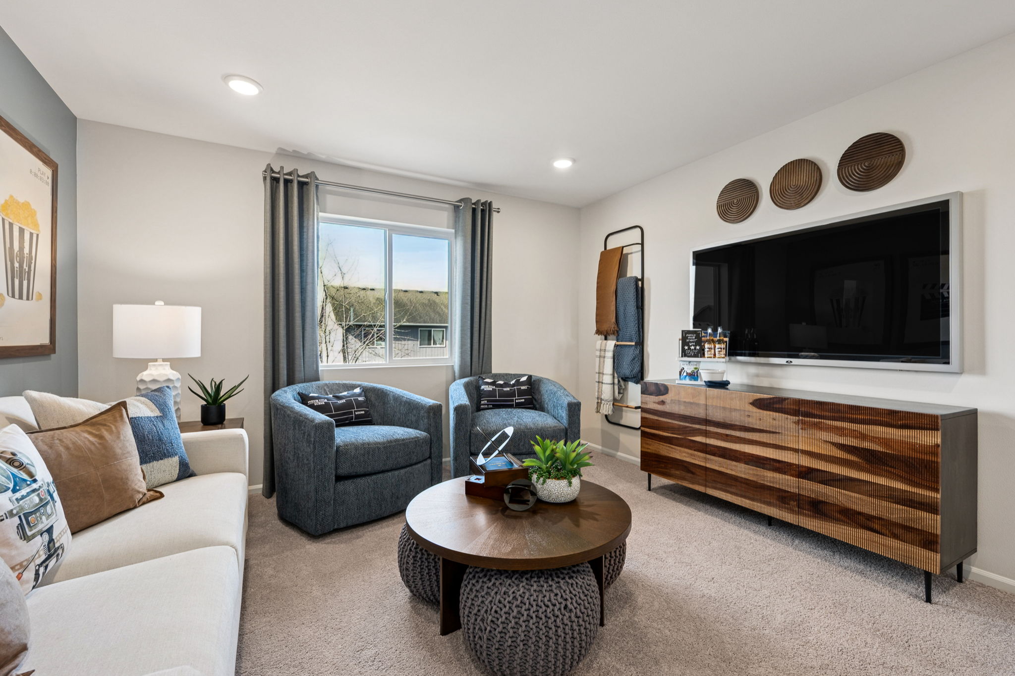 A living room with a tv and couches.