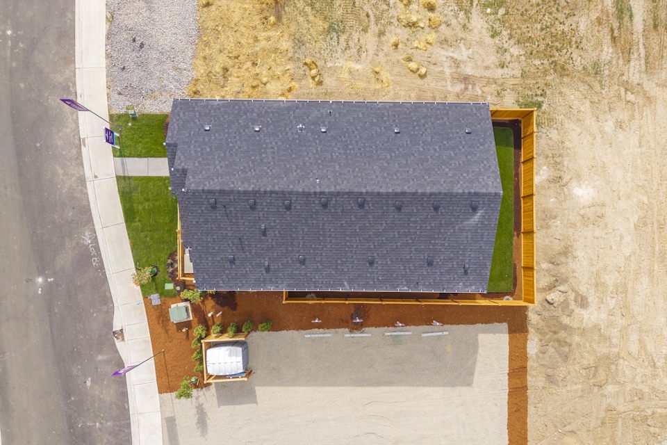 A small square building with a small pool in the middle.