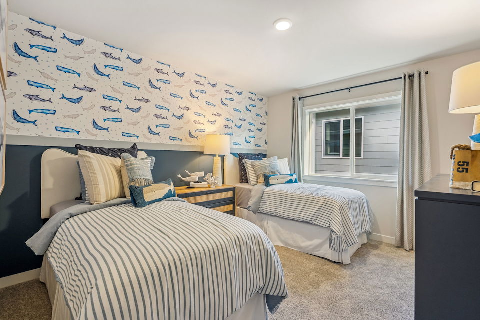 A bedroom with two beds.