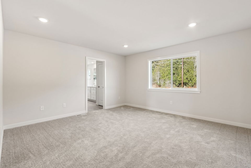 A room with a window and a door.