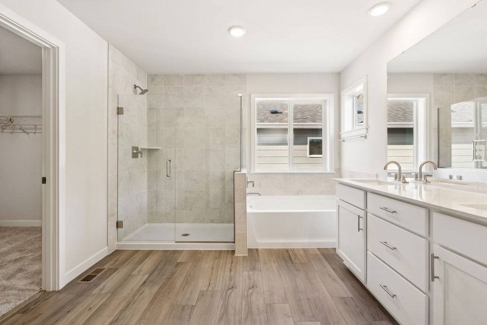 A bathroom with a tub and sink.
