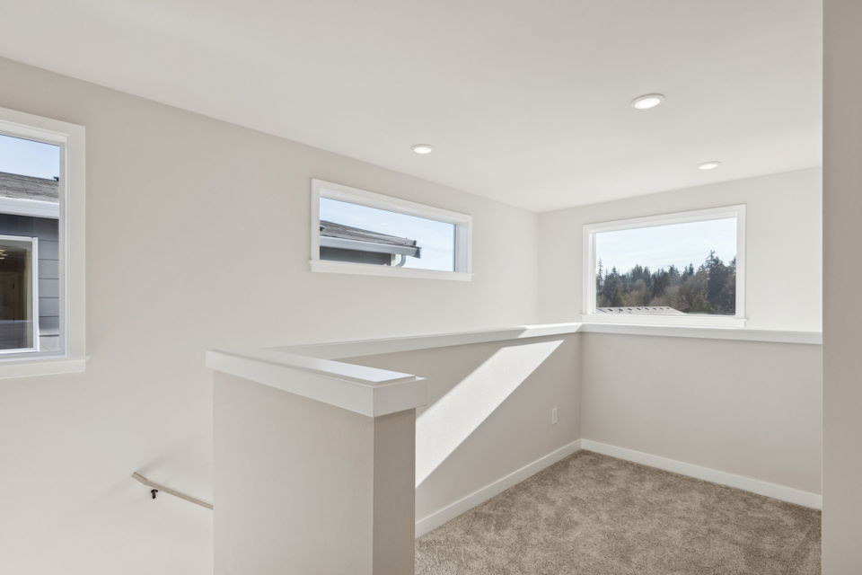 A room with a window and a shelf with a window.