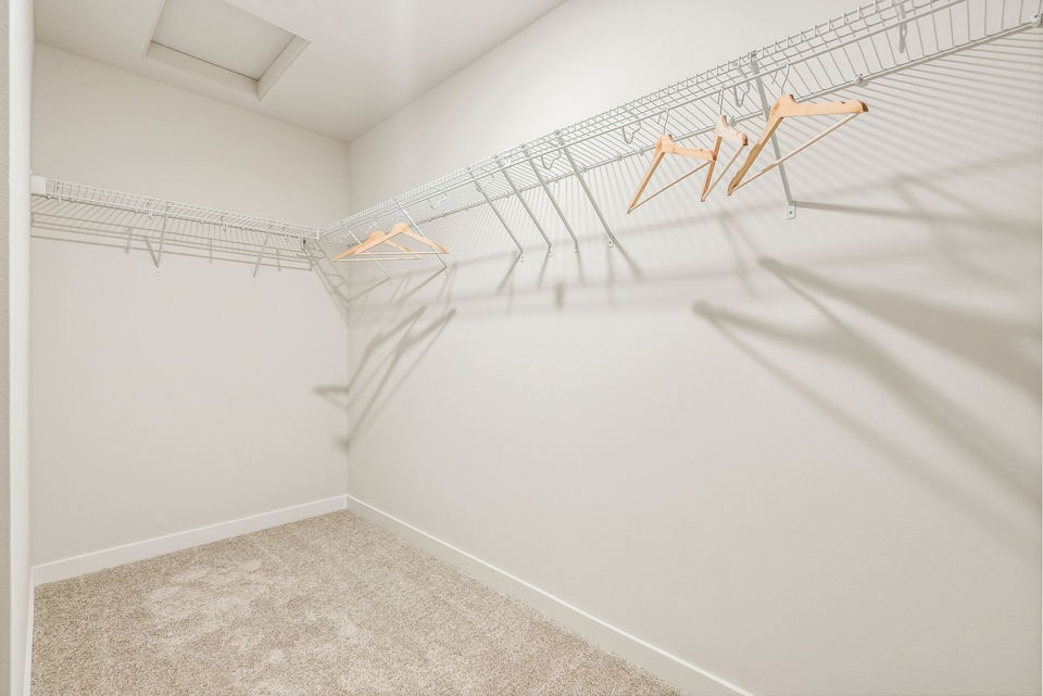 A white hallway with a white wall.